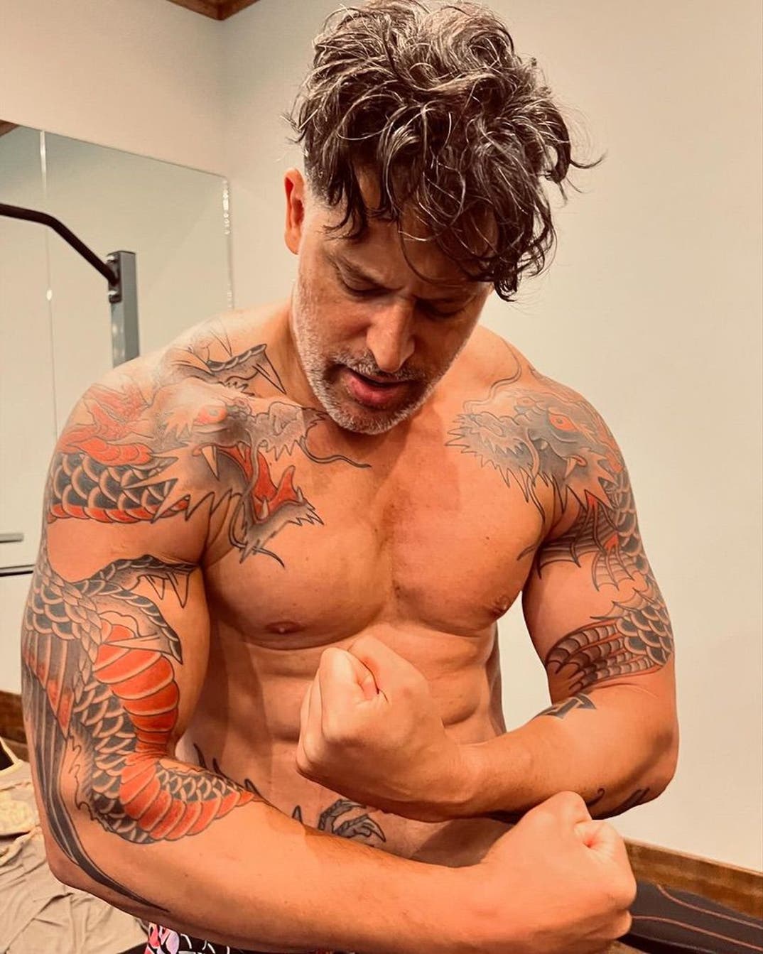 Joe Manganiello The dragon work across his shoulders and arms Joe Manganiello tattoos: The dragon work across his shoulders and arms