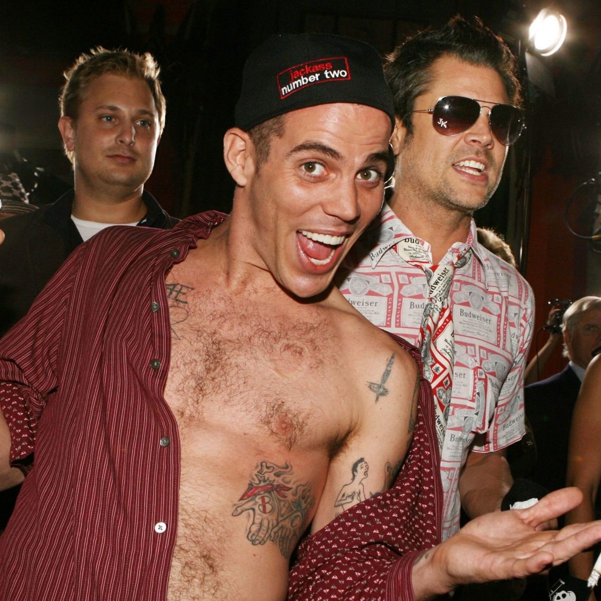 Johnny Knoxville chest and arm tattoos