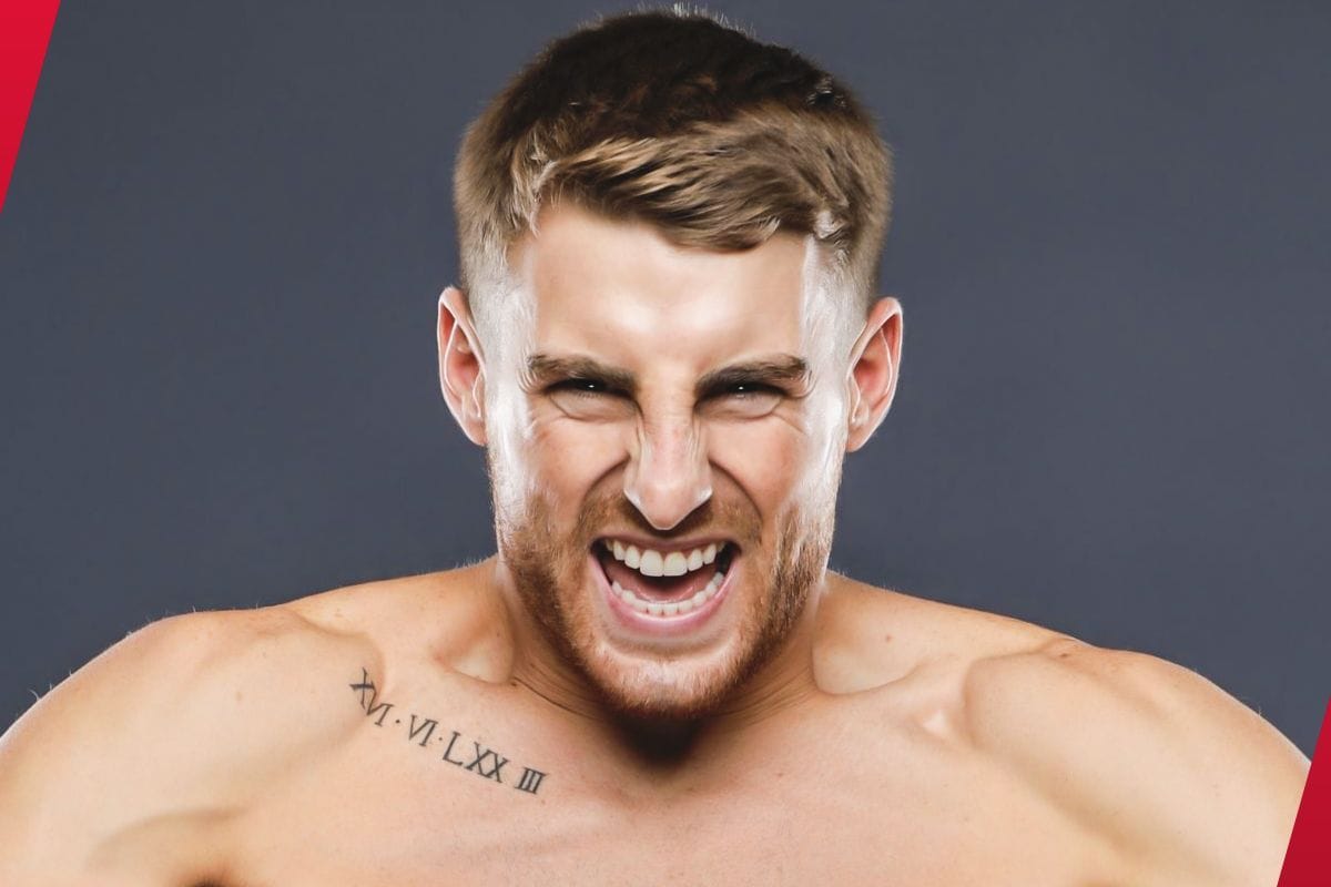 Jonathan Haggerty tattoos: front view of the documented chest lettering