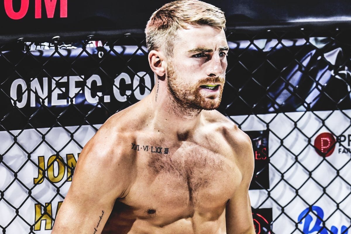 Jonathan Haggerty tattoos: three-quarter cage view of the same chest design