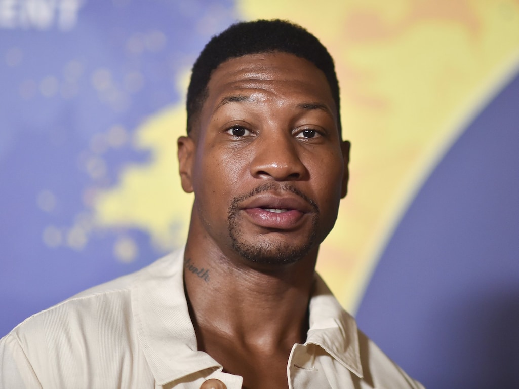 Jonathan Majors tattoos: Genuine tattoo photograph showing the documented Rebirth neck tattoo; not a contextual fallback.