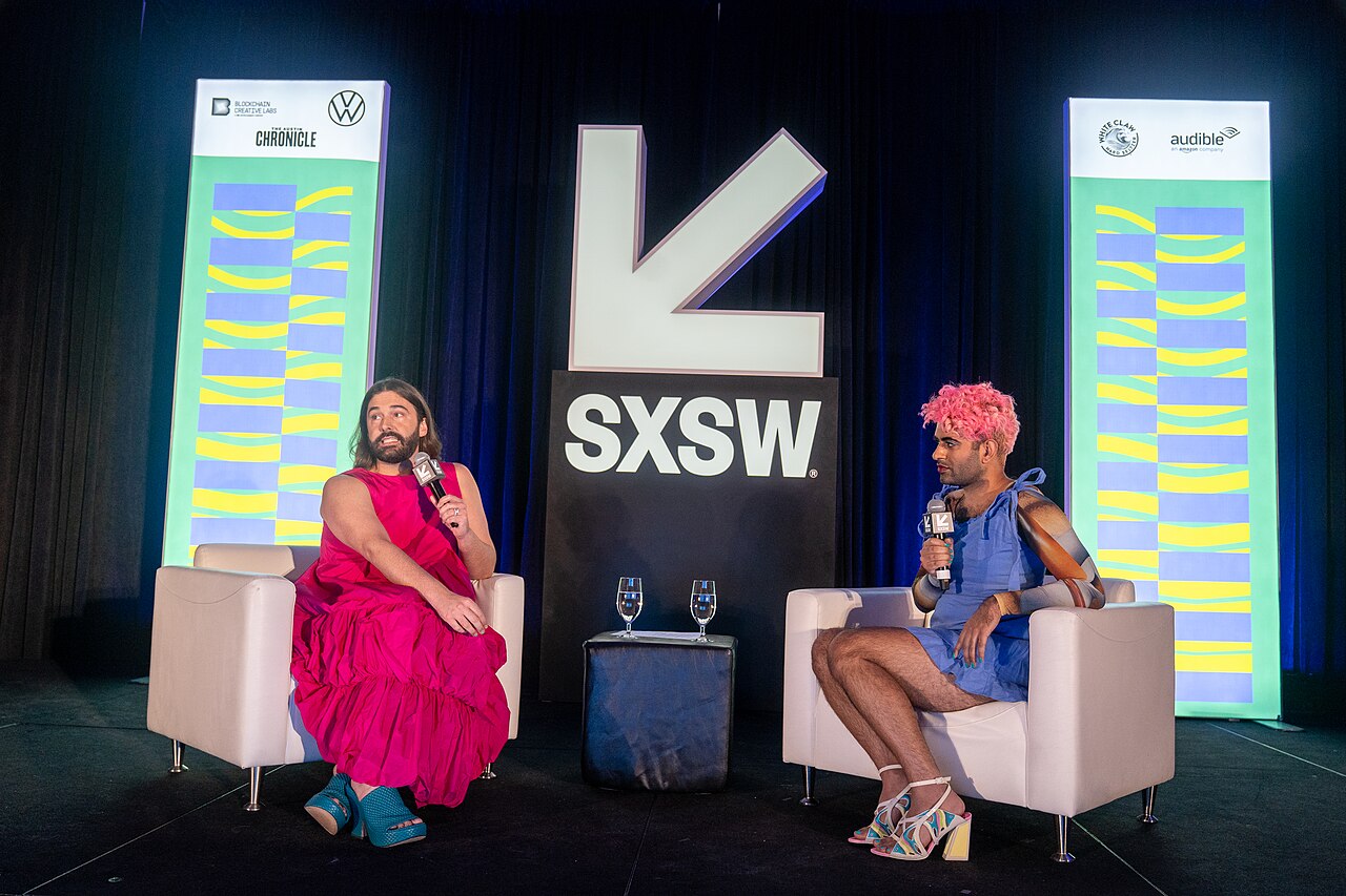 Jonathan Van Ness Contextual SXSW panel moment illustrating JVN's public style, not tattoo evidence Jonathan Van Ness in a contextual photograph: Contextual SXSW panel moment illustrating JVN's public style, not tattoo evidence; not tattoo evidence