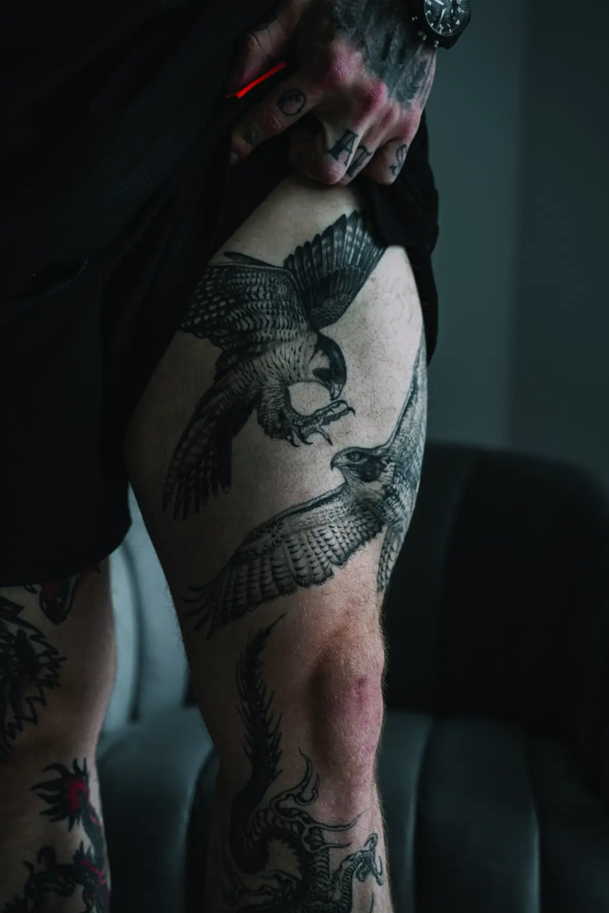 Jordan Shallow tattoos: Inked close photograph showing the eagle tattoo and additional lower-leg imagery in Jordan Shallow’s documented collection