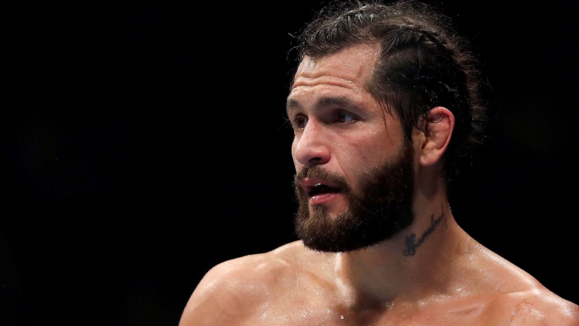 Jorge Masvidal tattoos: distinct action photograph with the neck tattoo visible