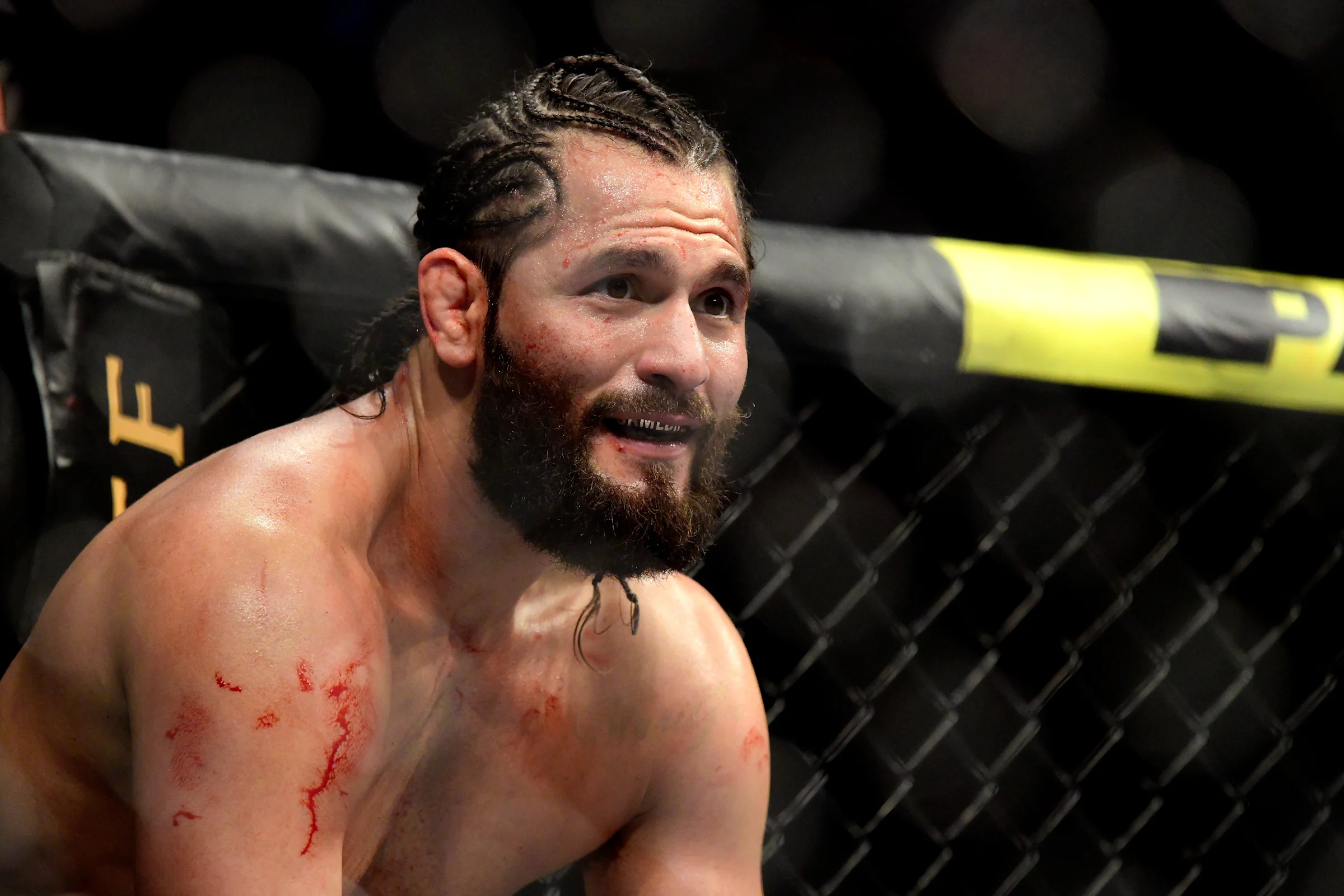 Jorge Masvidal tattoos: distinct shirtless career portrait with neck tattoo visible