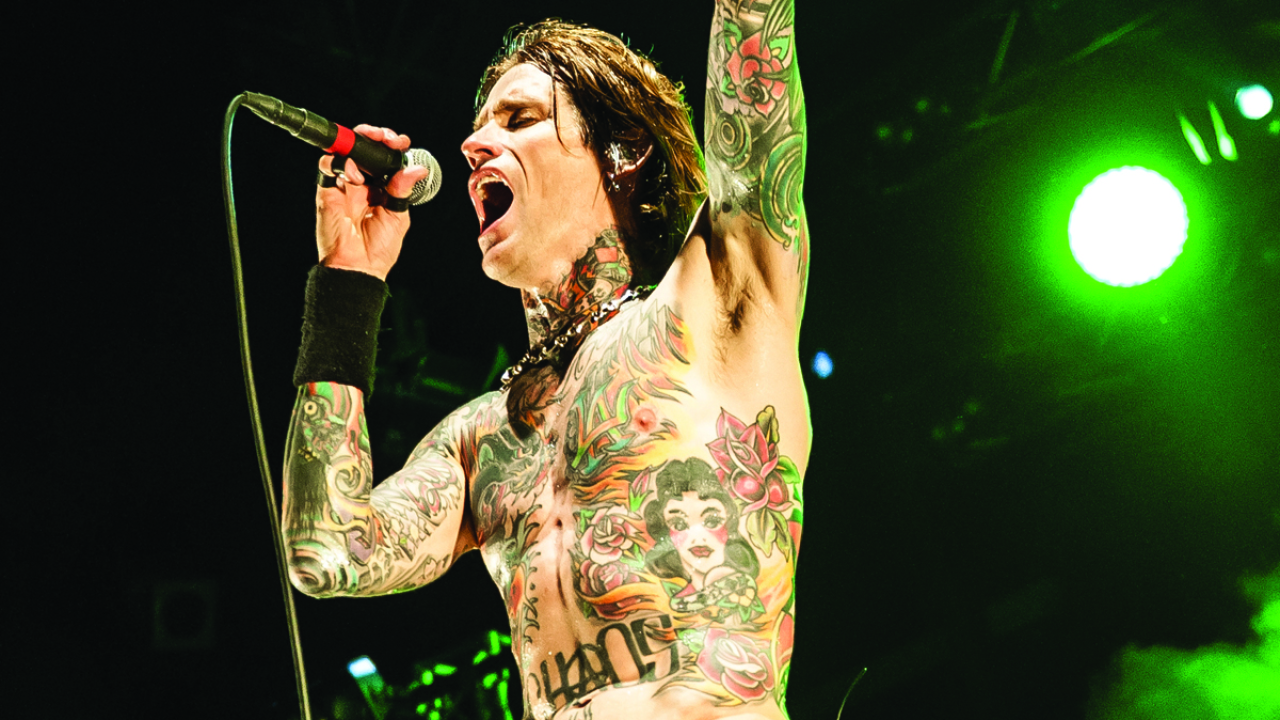 Josh Todd chest and arm tattoos