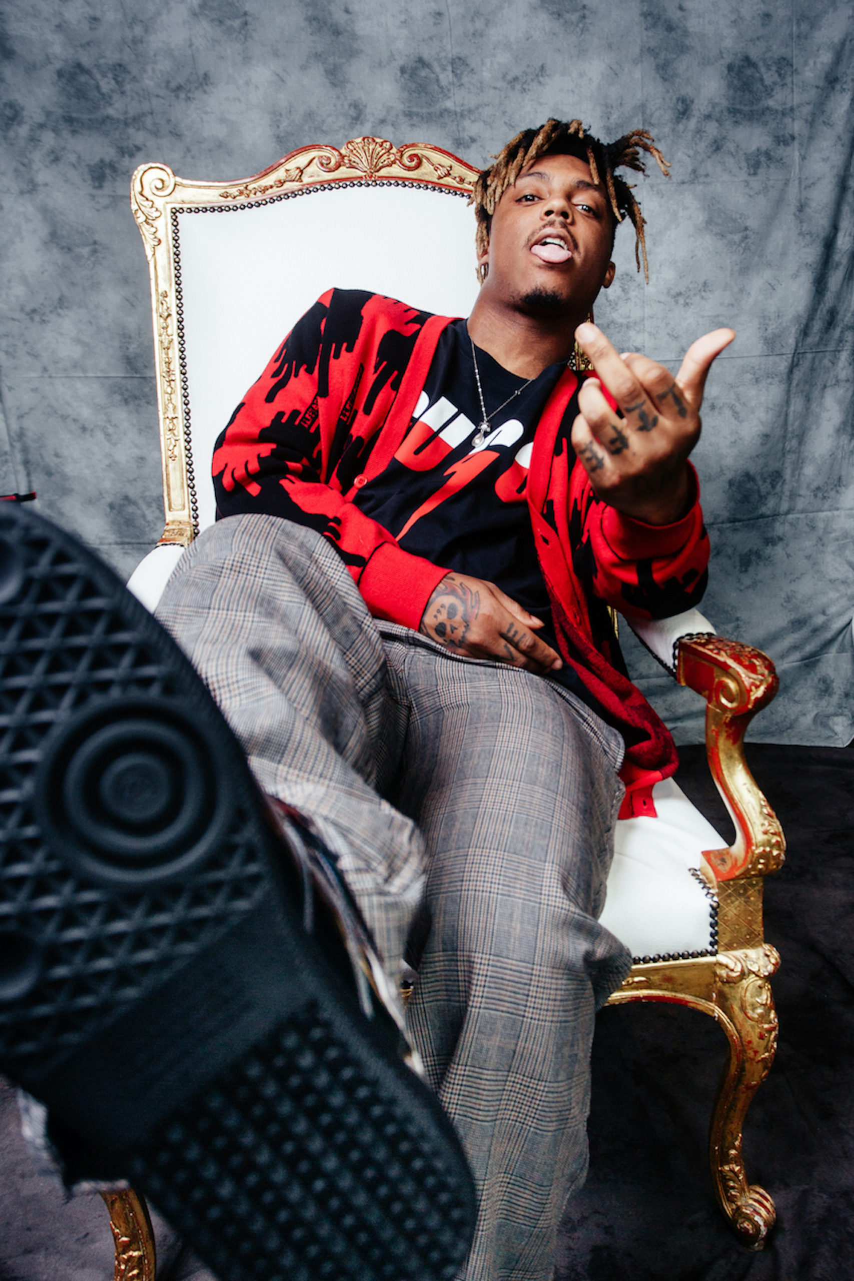 Juice WRLD tattoos: high-resolution portrait showing the hand symbols and 999-era ink