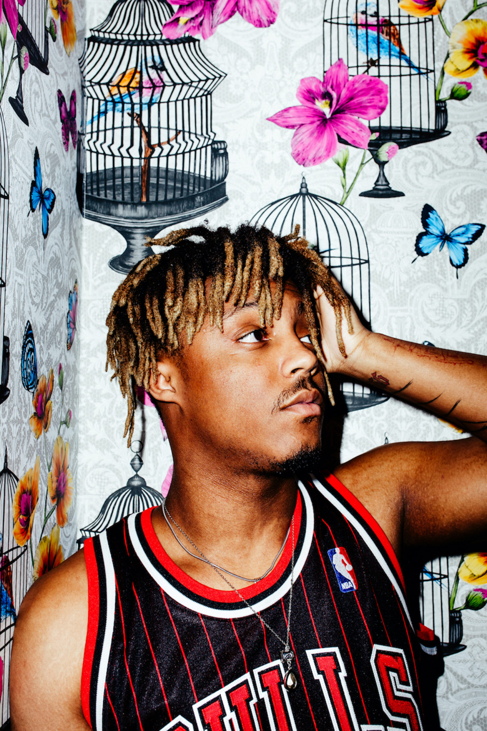 Juice WRLD tattoos: high-resolution portrait showing the hand and finger lettering
