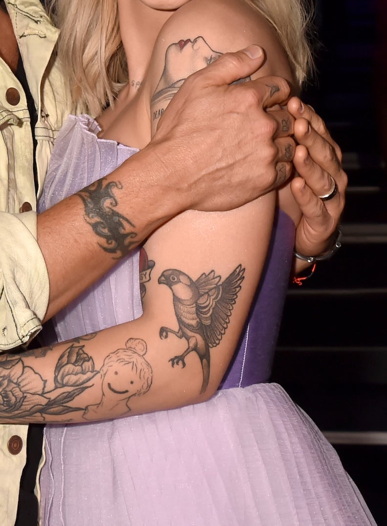 Julia Michaels bird in flight arm tattoo