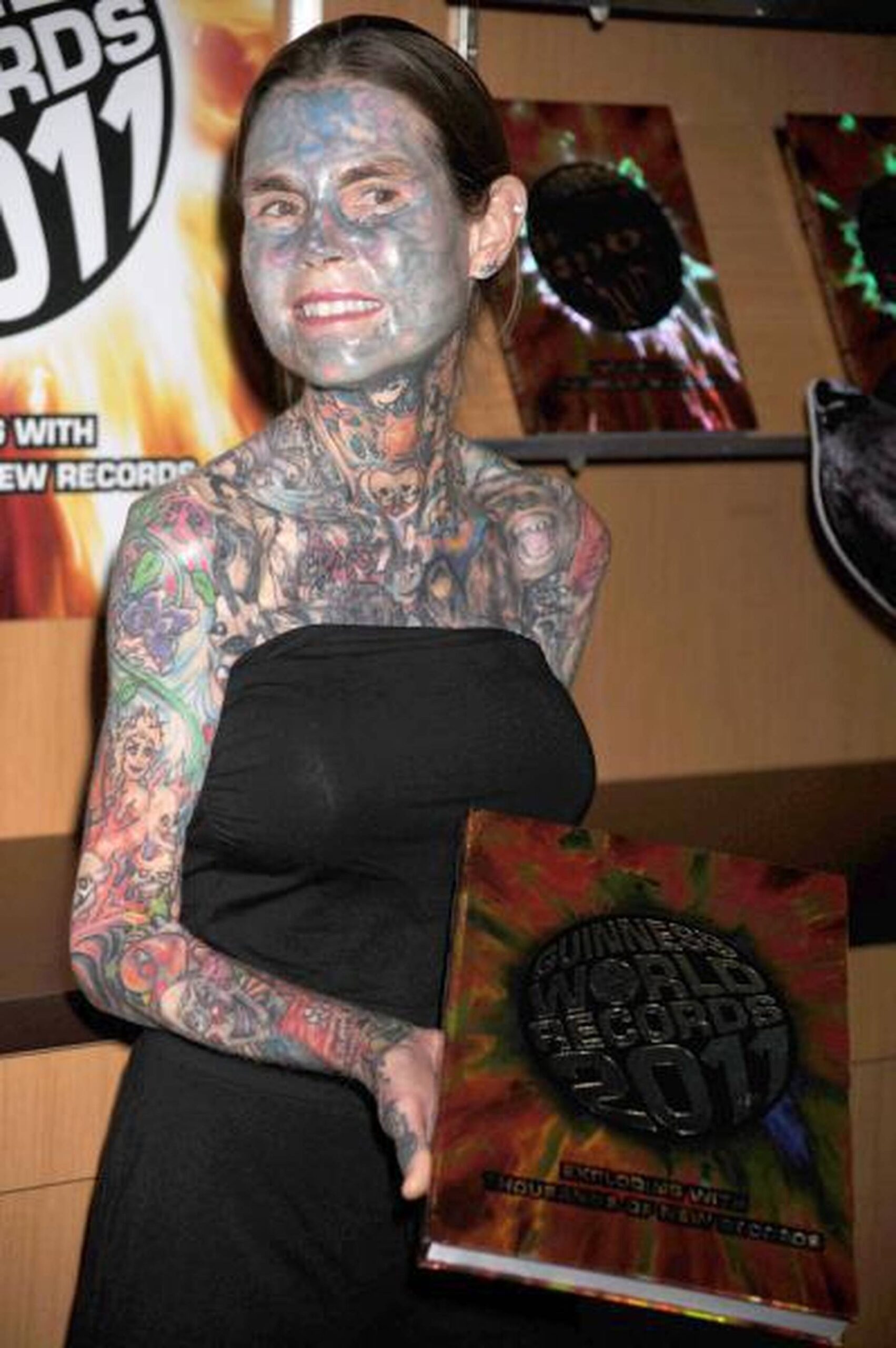 Julia Gnuse tattoos: Julia Gnuse chest and upper-body tattoo scenes, selected because the named tattoo areas are clearly visible in a distinct high-resolution photograph