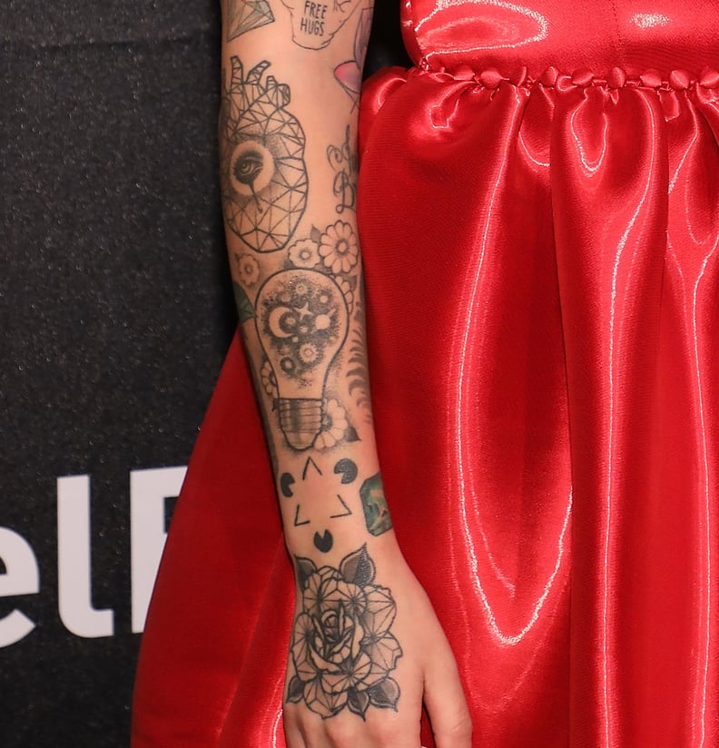 Julia Michaels perception symbol and light bulb arm tattoos