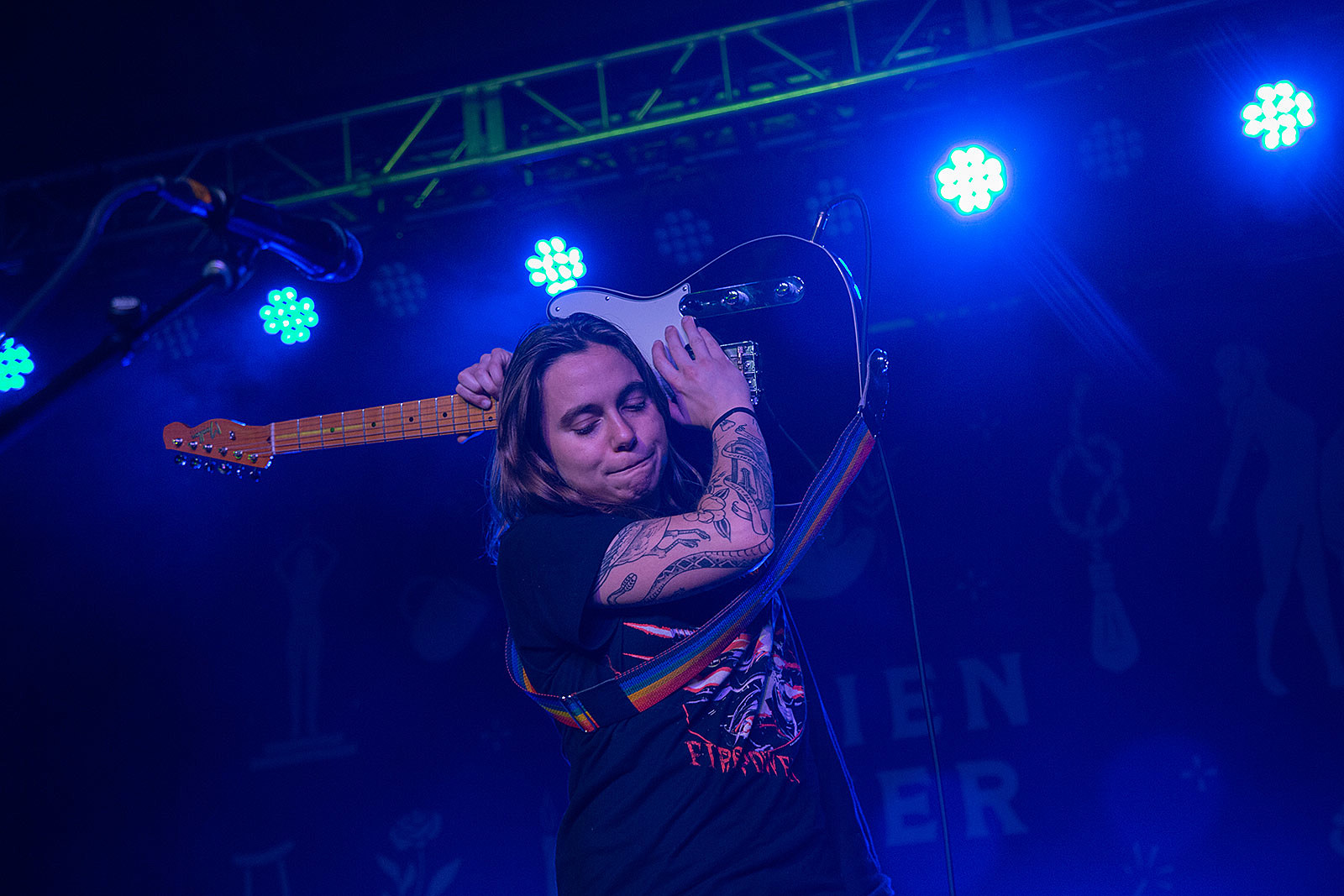 Julien Baker tattoos: Inline tattoo image for the visible lettering and hand-tattoo section.