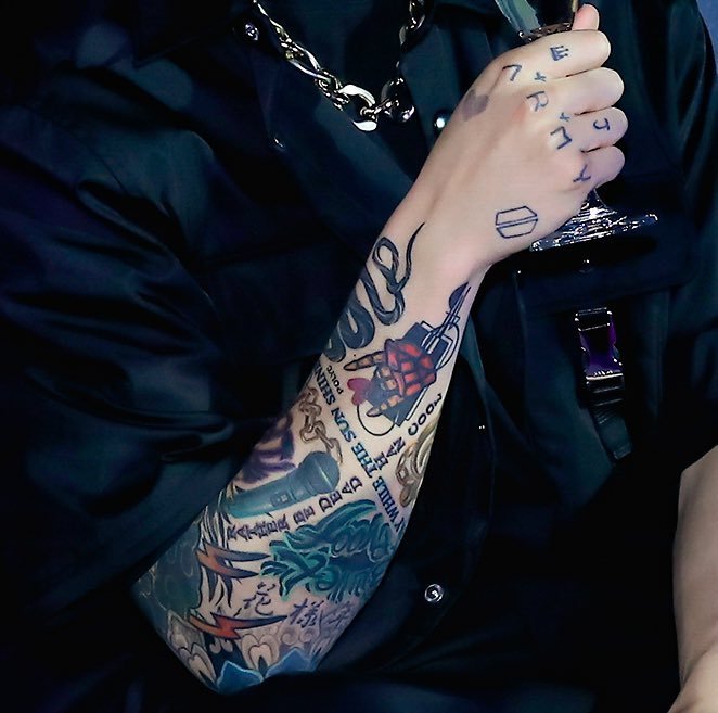 Jungkook ARMY and GOOD LUCK HAVE FUN forearm tattoos