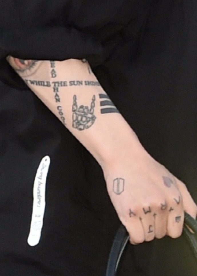 Jungkook WHILE THE SUN SHINES and skeleton hand tattoos