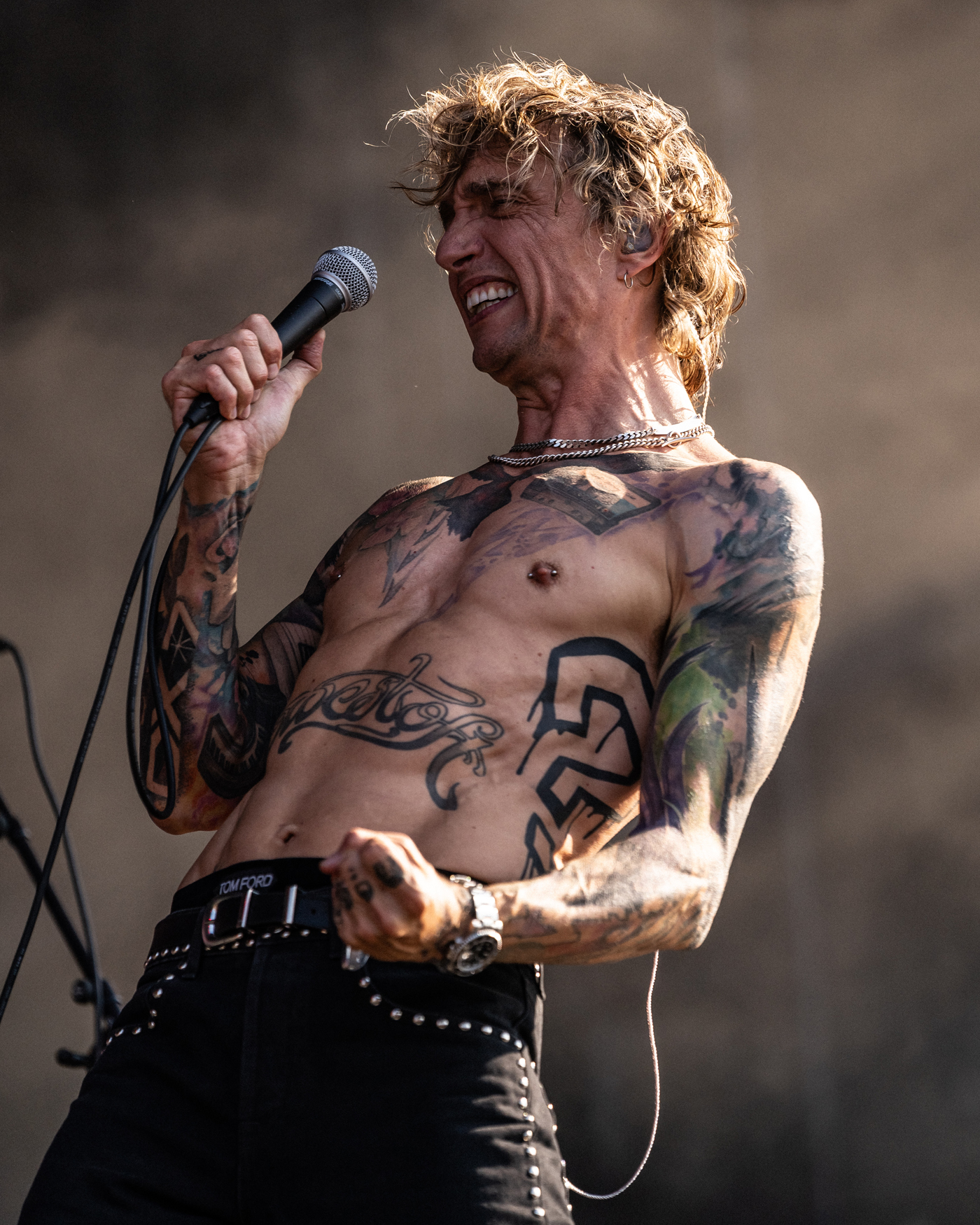 Justin Hawkins tattoos: Justin Hawkins winged microphone section image