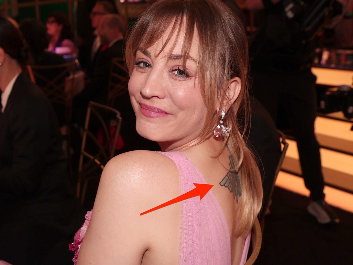 Kaley Cuoco tattoos: Separate editorial photograph showing the finished moth in a centered upper-back view.