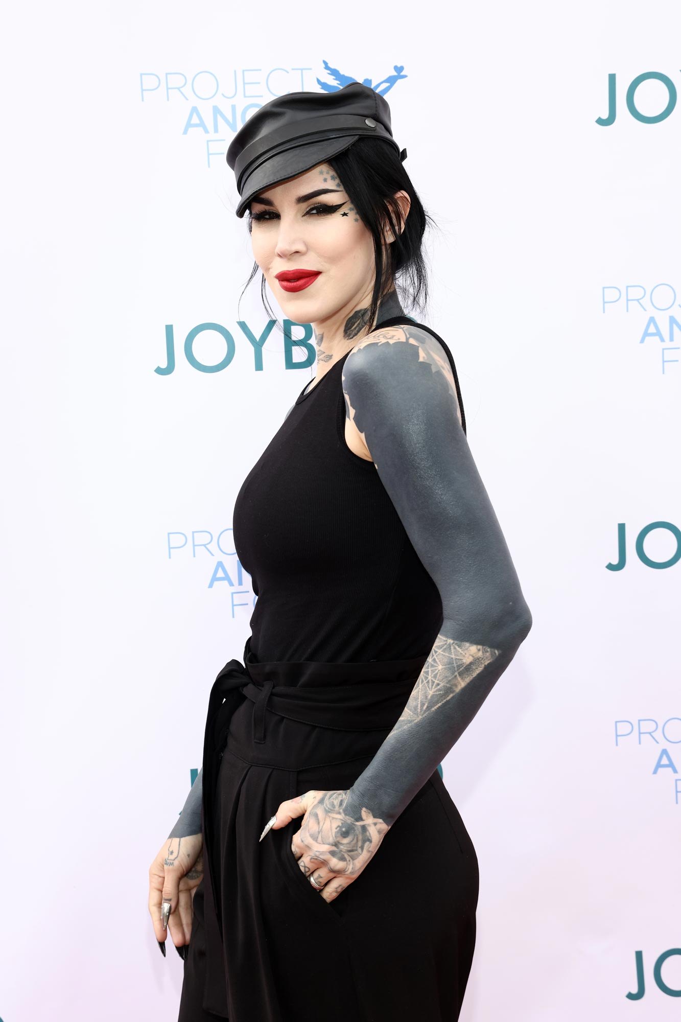 Kat Von D blackout sleeve and hand tattoos