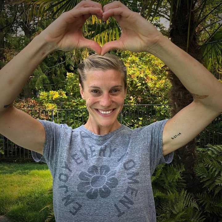 Katee Sackhoff tattoos: archival photograph showing the compact E=mc2 lettering on Sackhoff’s inner arm
