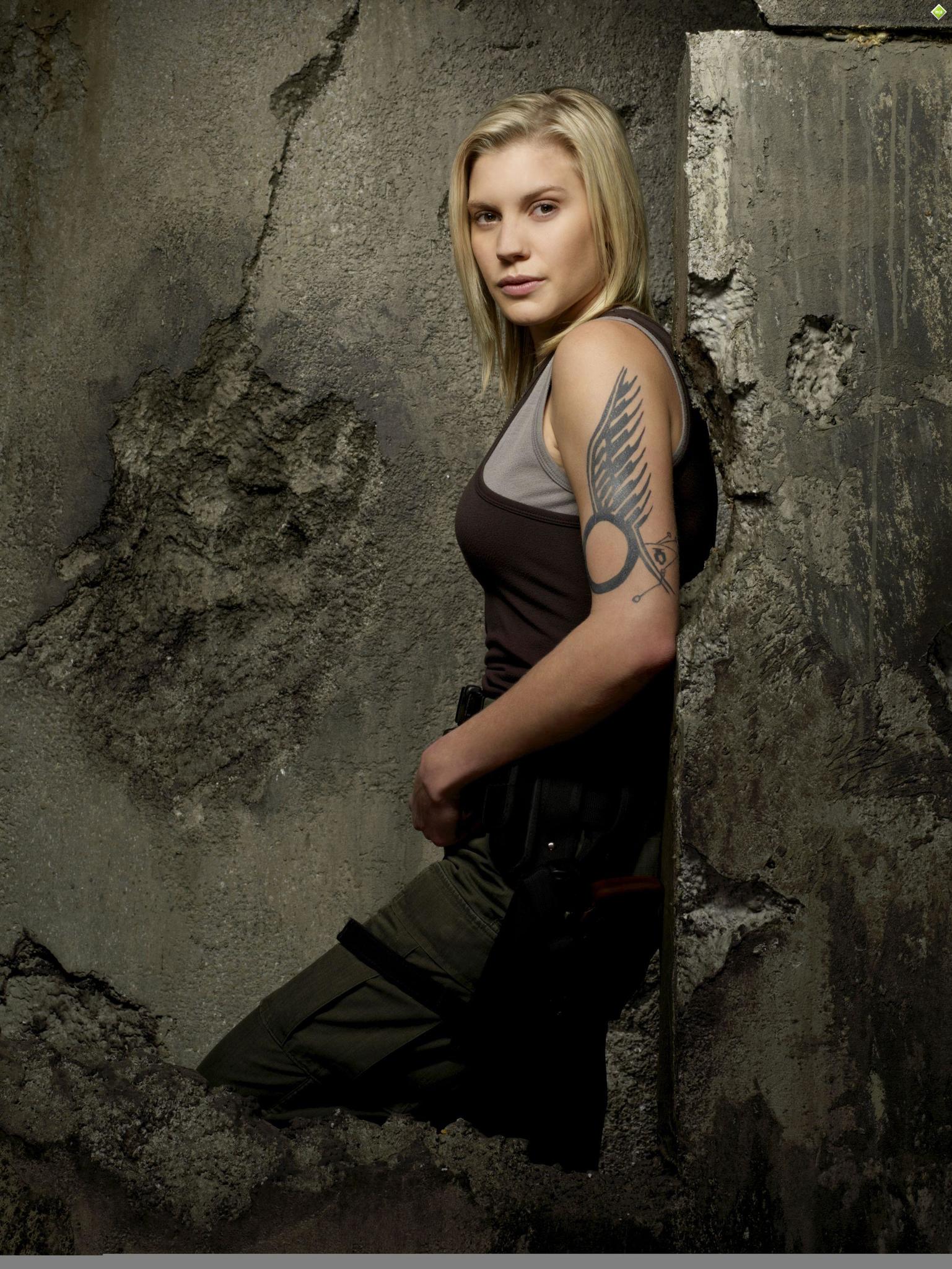 Katee Sackhoff tattoos: official portrait showing the documented winged upper-arm tattoo