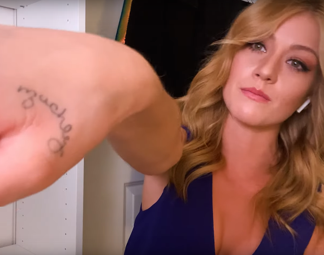 Katherine McNamara tattoos: Close photographic evidence of the Muchly family-word tattoo.