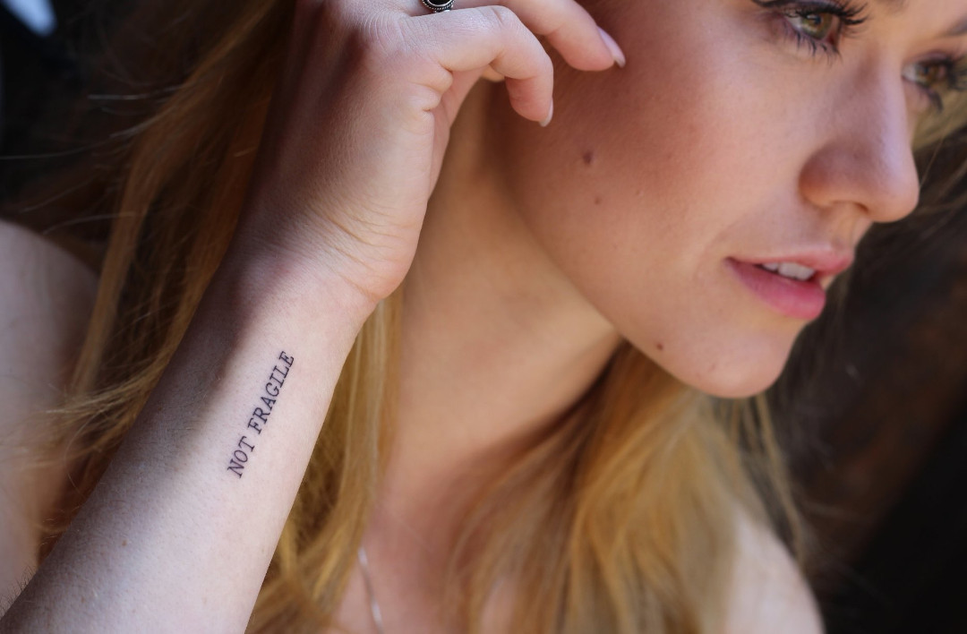 Katherine McNamara tattoos: Photographic evidence of the wrist symbol linked to McNamara’s grandfather’s necklace.