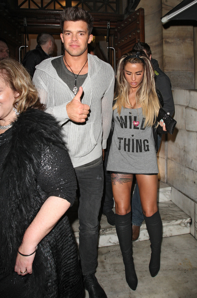 Katie Price tattoos: black and pink garter-style thigh tattoo