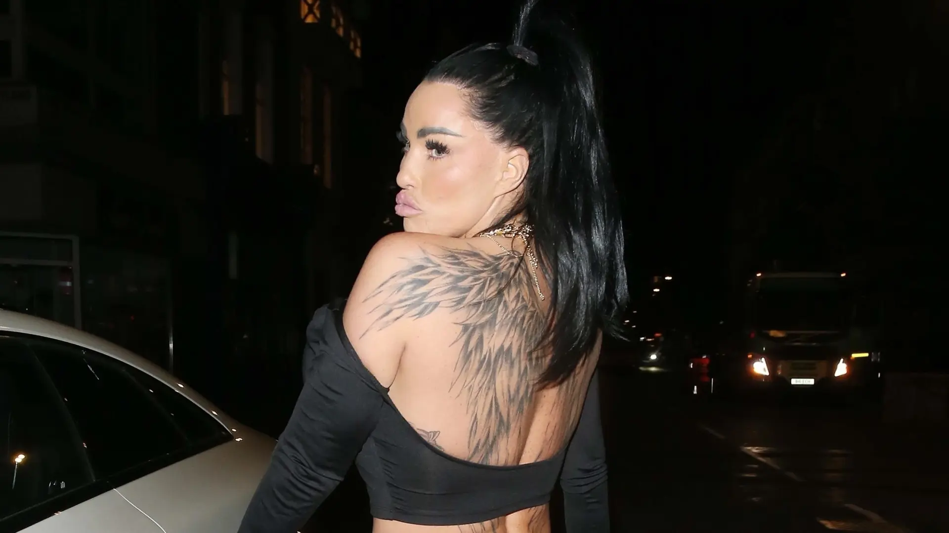 Katie Price tattoos: second angle showing layered feather and shoulder placement