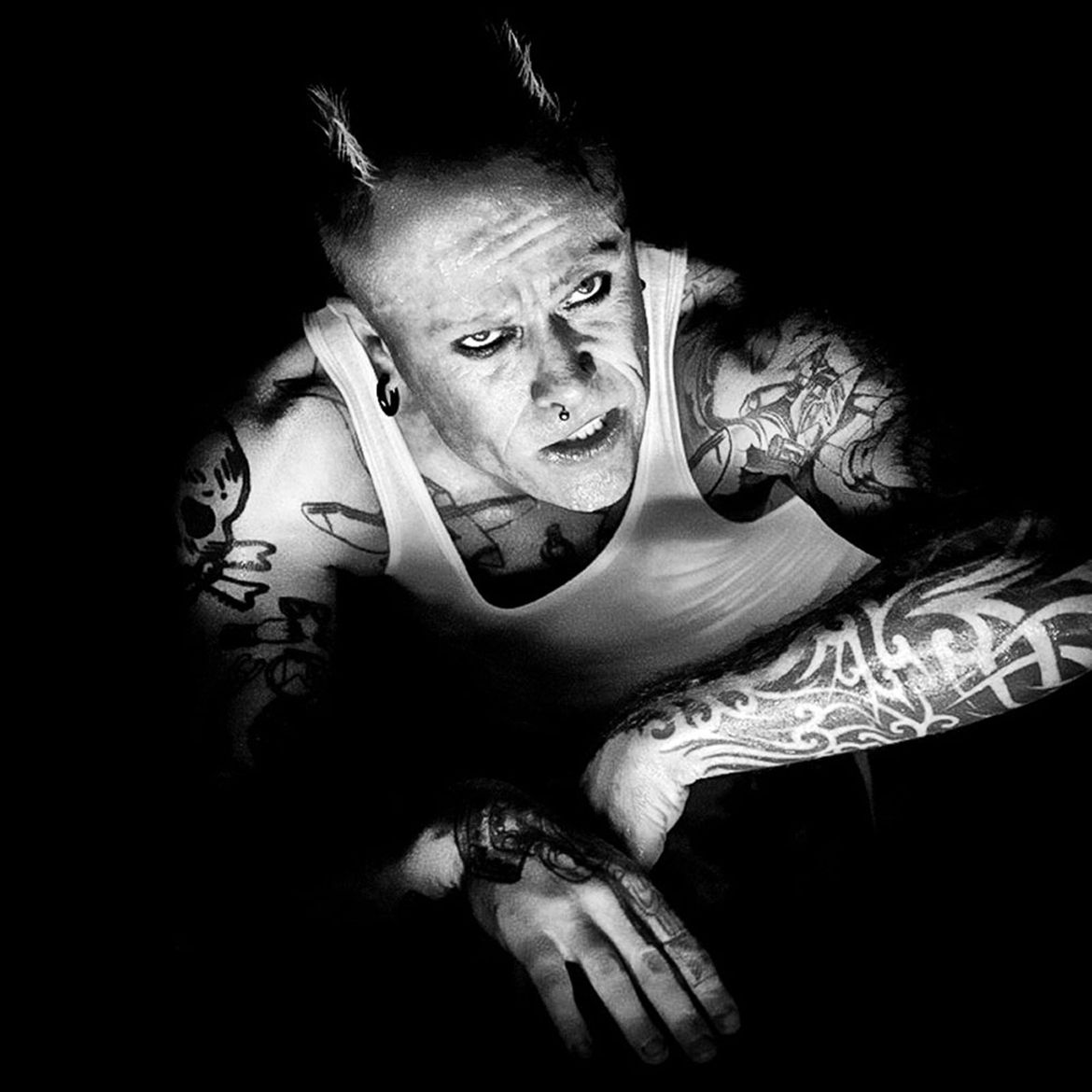 Keith Flint arm and chest tattoos