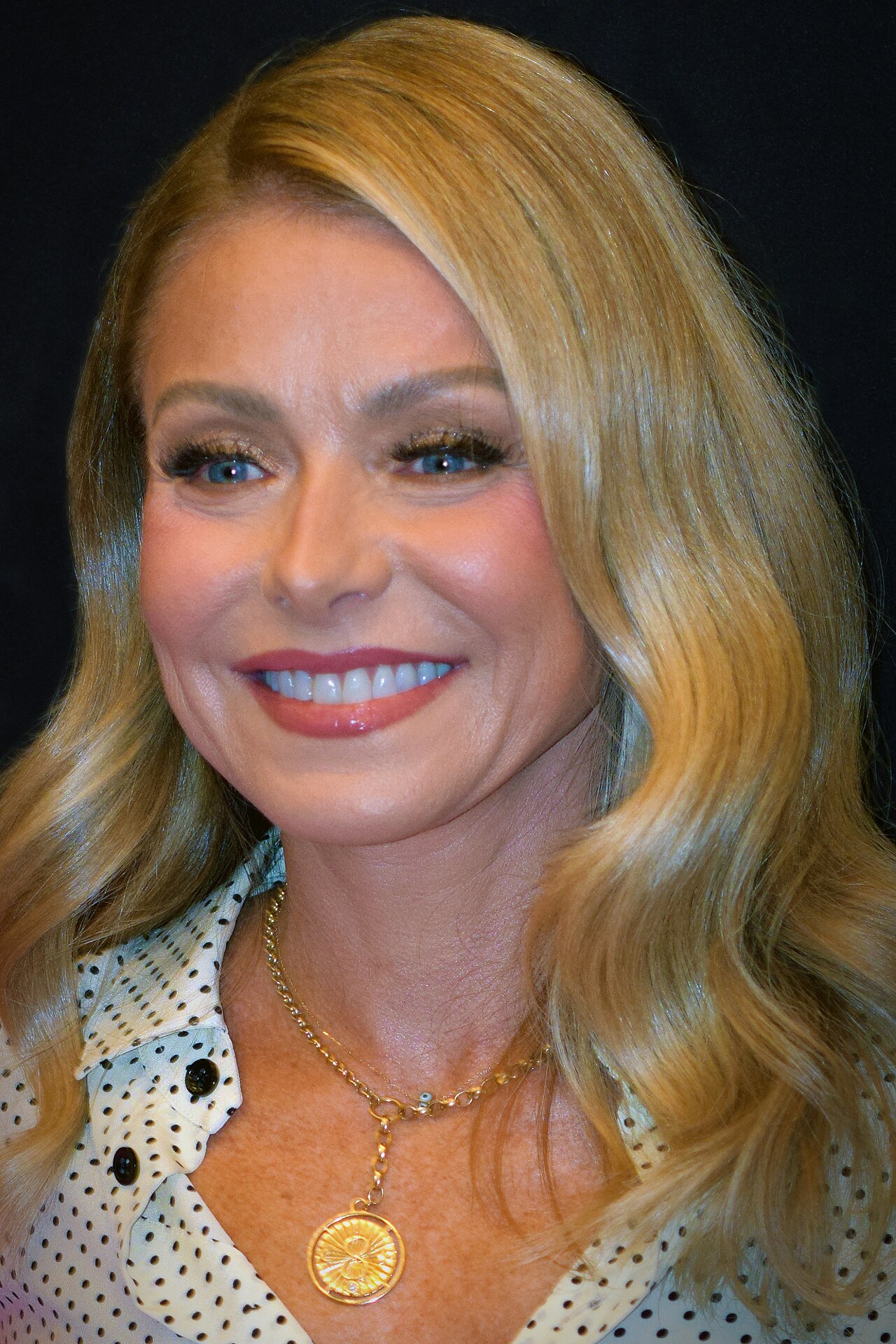Kelly Ripa in a contextual photograph: Contextual photograph, not tattoo evidence; Ripa at the 2023 PaleyFest opening.; not tattoo evidence