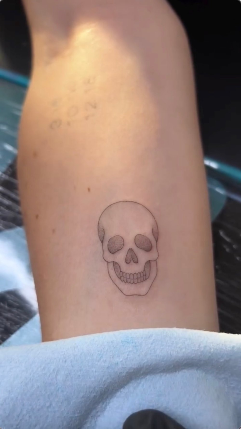 Kelly Rizzo tattoos: The delicate skull tattoo keeps the pair from feeling too sweet