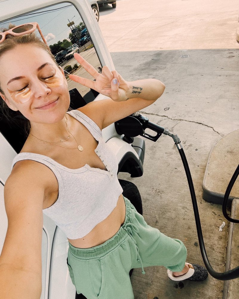 Kelsea Ballerini showing her Amazing Grace lyric tattoo