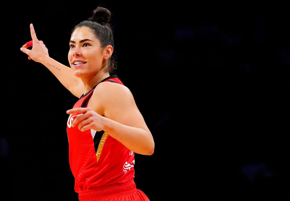 Kelsey Plum tattoos: Action image identified by ESPN's caption with the right-forearm phrase; not a close-up transcription.