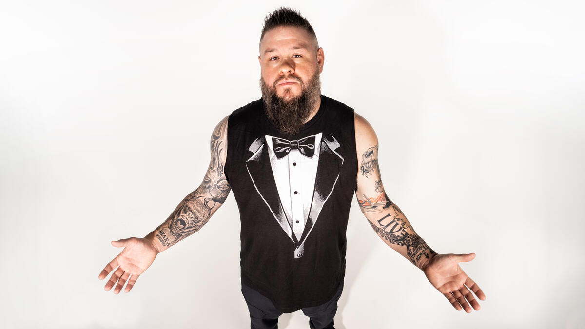 Kevin Owens dinosaur tattoos