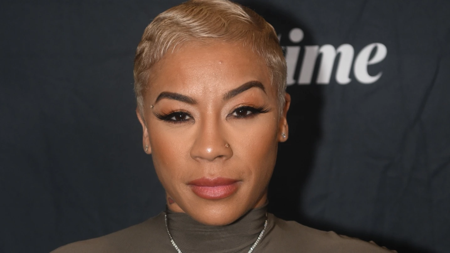 Keyshia Cole tattoos: Keyshia Cole’s small Have Faith neck tattoo in close view