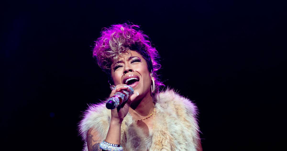 Keyshia Cole tattoos: Keyshia Cole’s upper-left-arm heart-and-stake tattoo