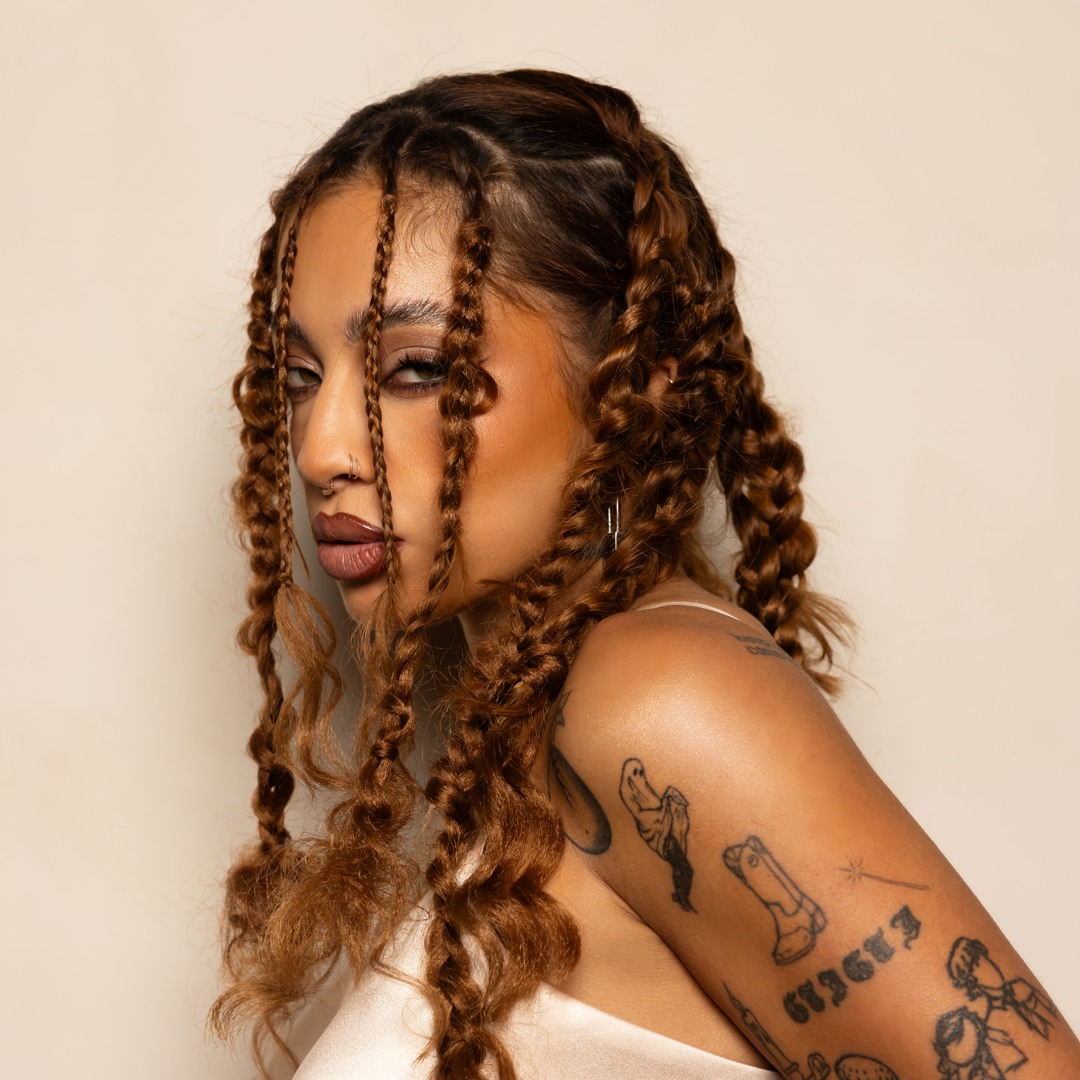 Kiana Ledé tattoos: Shoulder and upper-arm tattoo close portrait