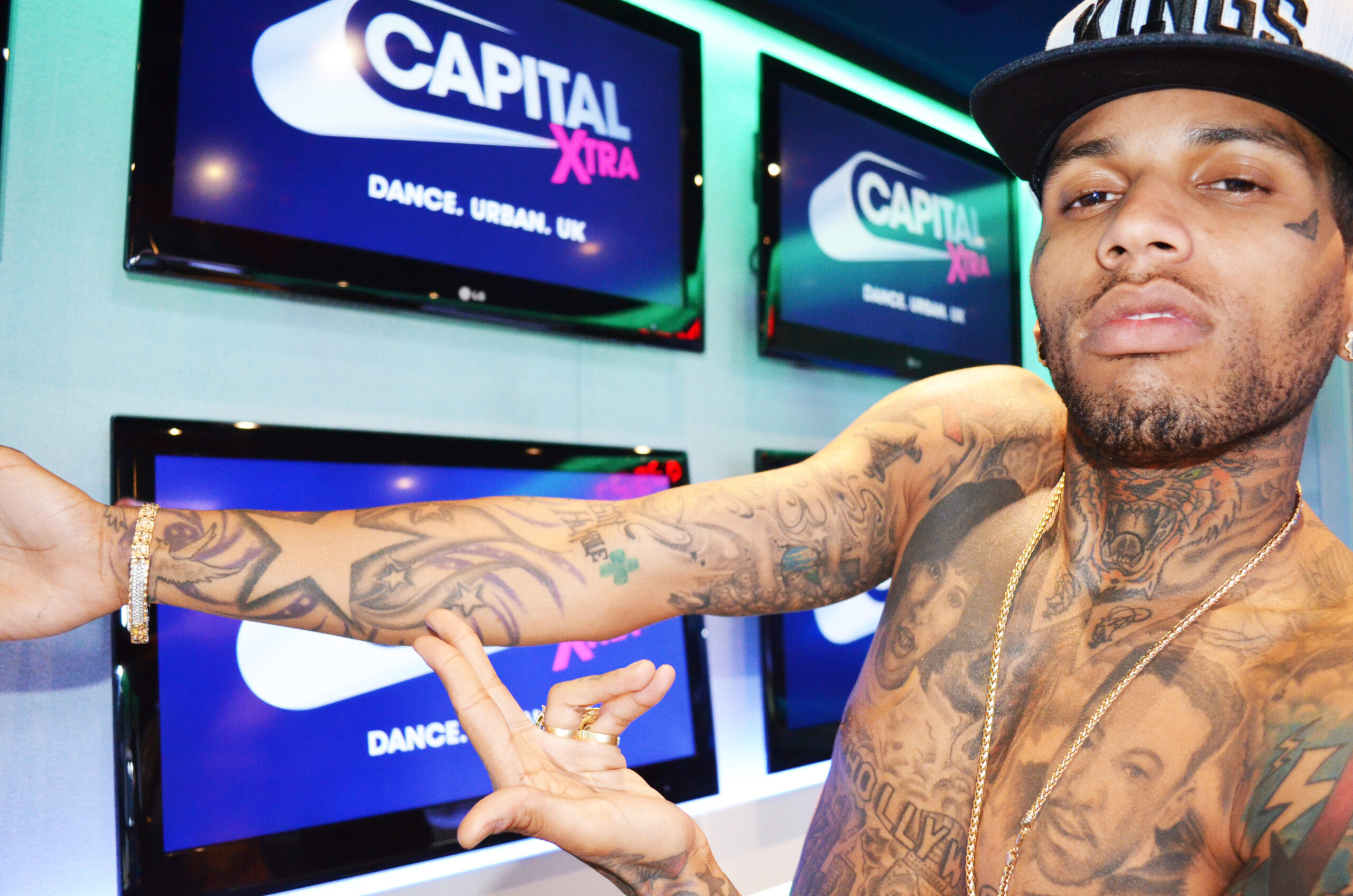 Kid Ink arm and neck tattoos