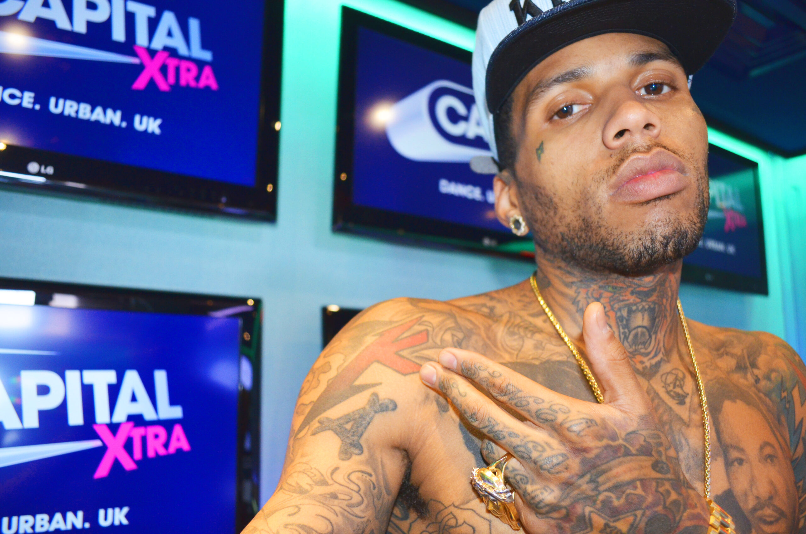 Kid Ink face and chest tattoos