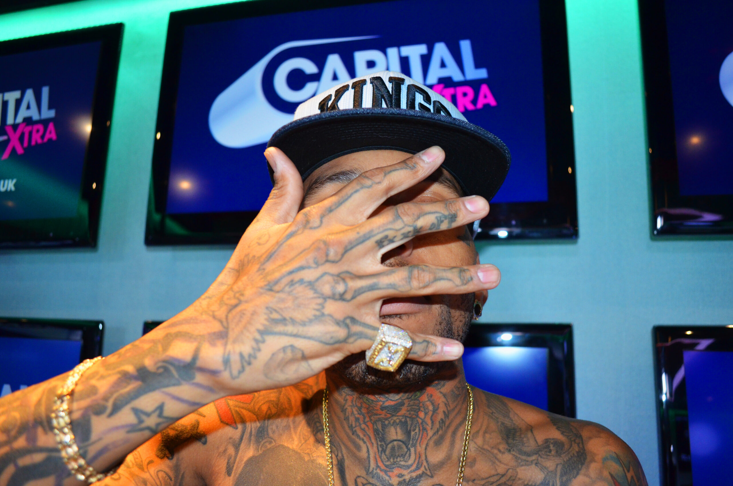 Kid Ink hand and chest tattoos