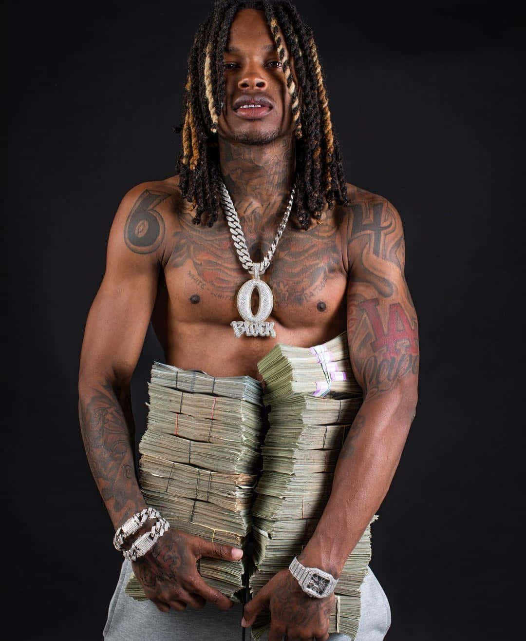King Von tattoos: high-resolution front portrait clearly showing the chest lettering, neck ink and shoulder tattoos