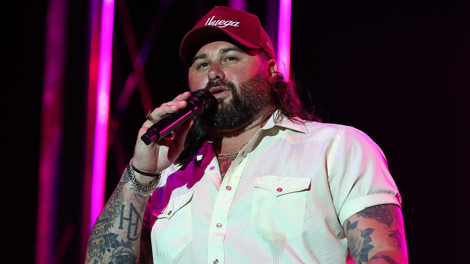 Koe Wetzel performing with visible arm tattoos