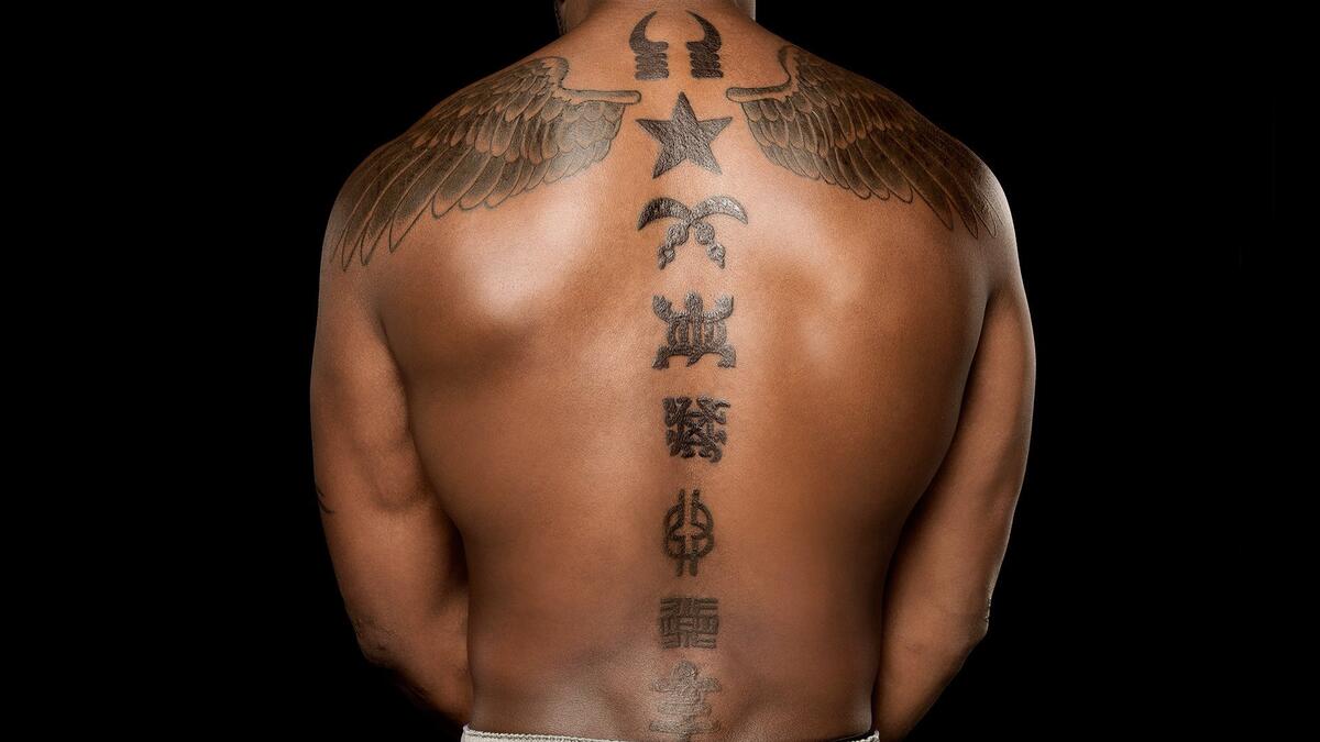 Kofi Kingston tattoos: inline back tattoo close-up
