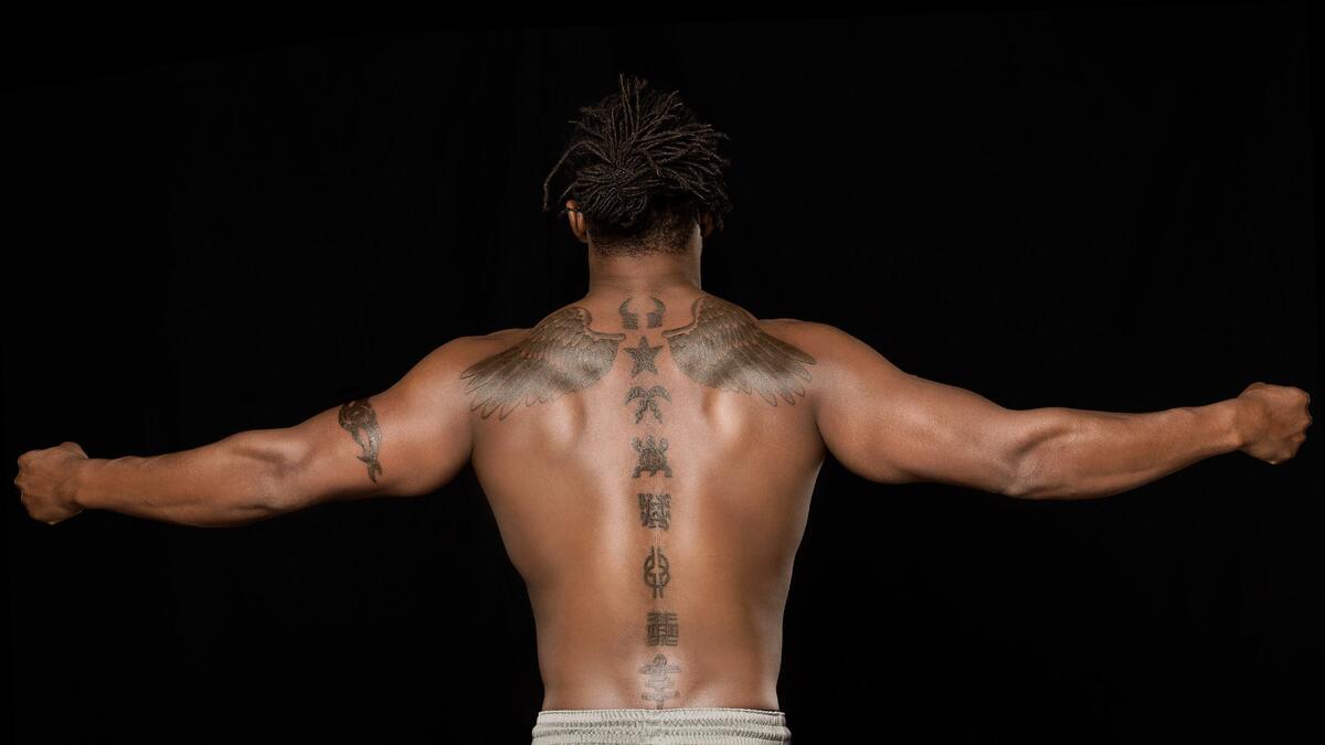 Kofi Kingston tattoos: inline spine tattoo image