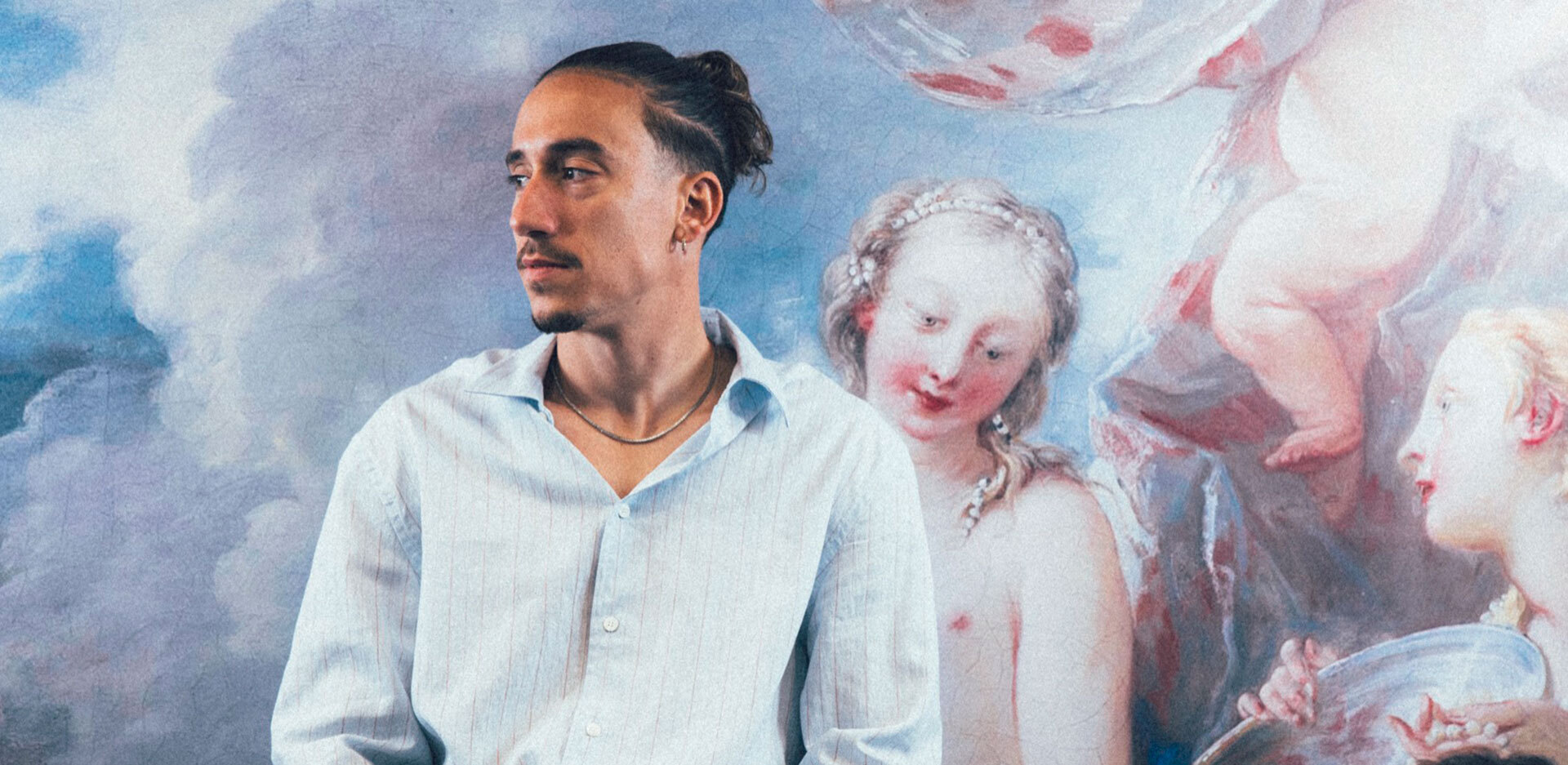 Konstantinos Tsimikas wider portrait context for how his tattoo collection reads on the body Konstantinos Tsimikas in a contextual photograph: wider portrait context for how his tattoo collection reads on the body; not tattoo evidence
