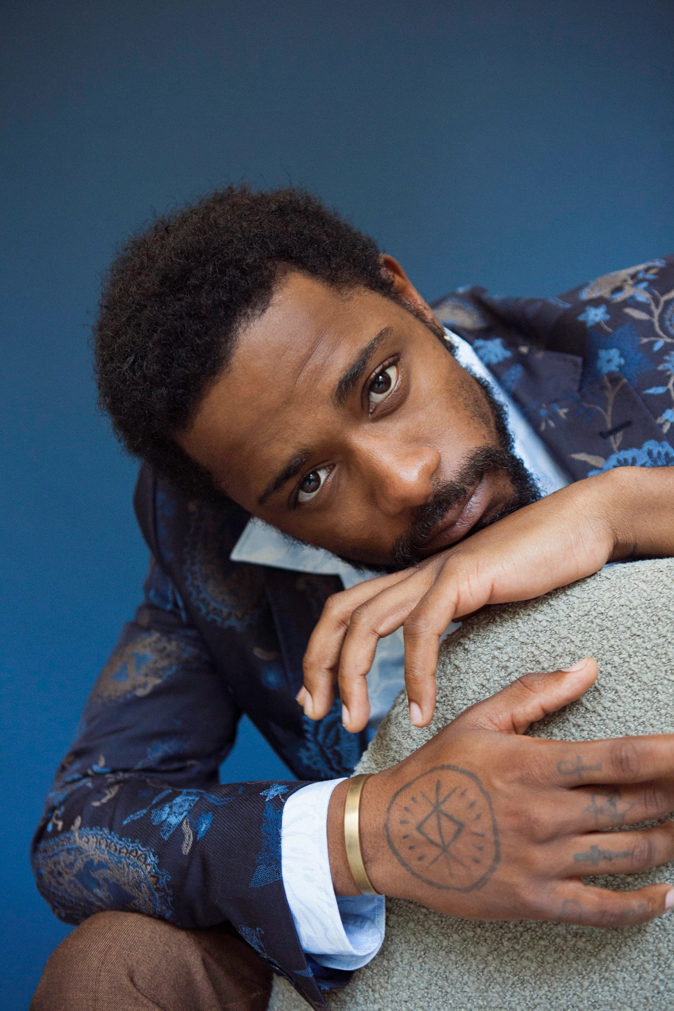 LaKeith Stanfield tattoos: LaKeith Stanfield circular hand tattoo and forearm collection reference