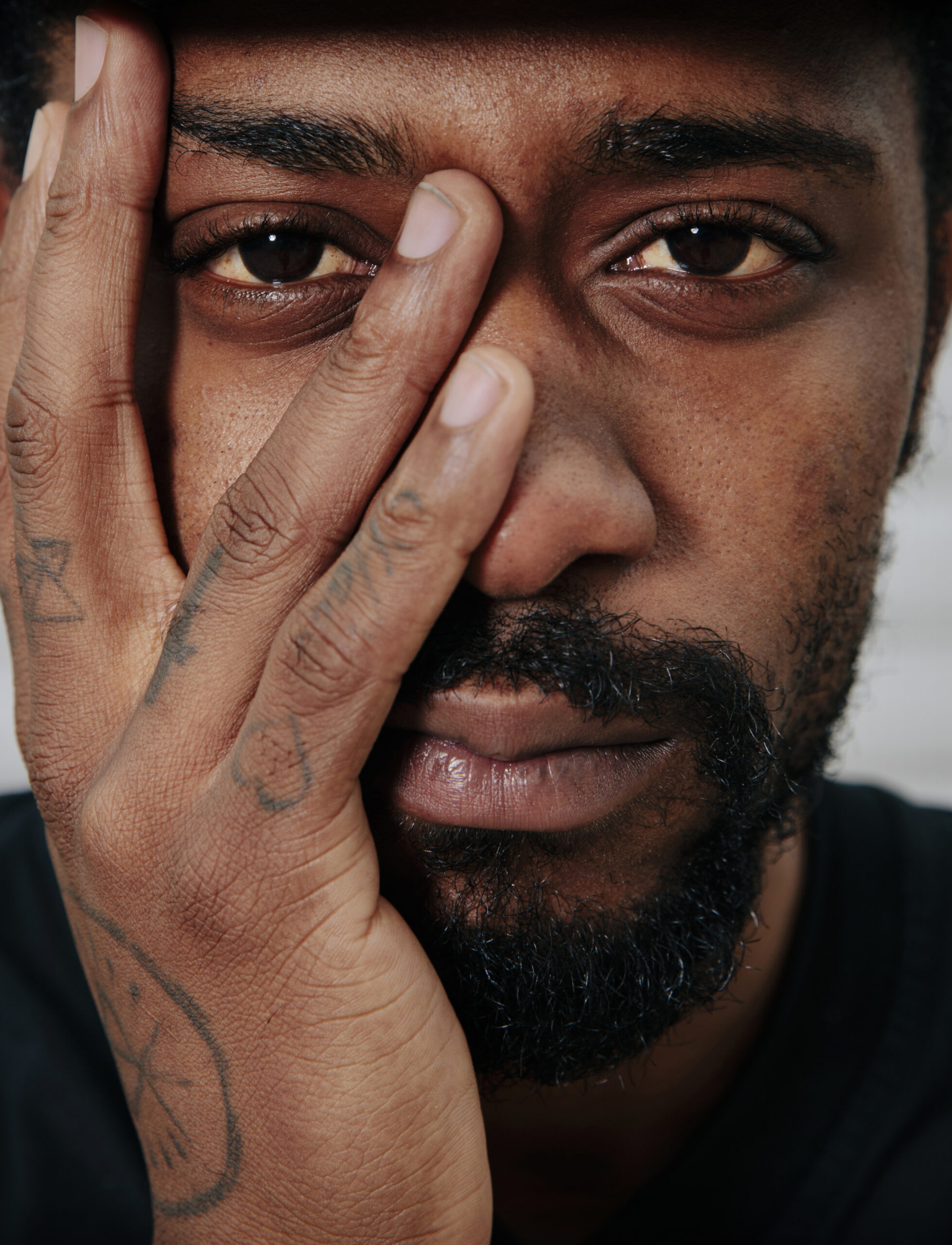 LaKeith Stanfield tattoos: LaKeith Stanfield face and hand tattoo reference