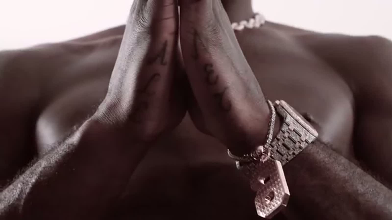 Lance Stephenson Wonder Wheel and Born Ready tattoo context Lance Stephenson tattoos: GQ Tattoo Tour hand and forearm close-up showing Stephenson’s tattooed arm while he explains the Wonder Wheel cover-up