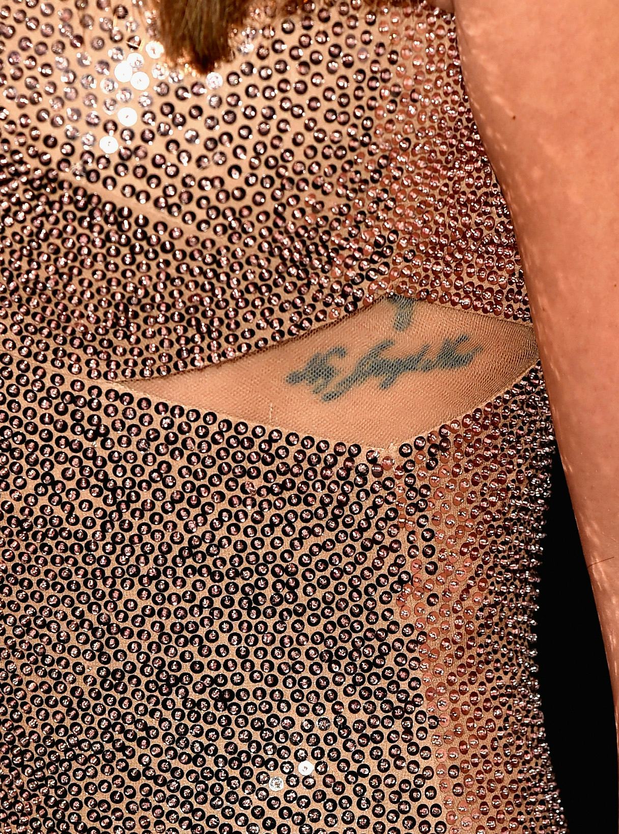 Lea Michele tattoos: My Angel Now rib tattoo