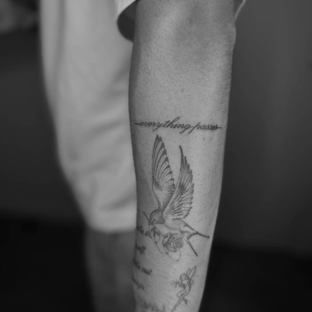 Romeo Beckham dove and wing tattoos