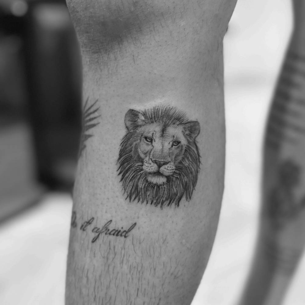 Romeo Beckham lion forearm tattoo